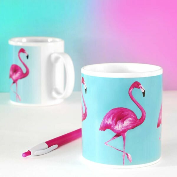 Ceramic mug with blue background and hot pink flamingo design on it